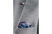 Load image into Gallery viewer, Teal Revolving Knot Silk Pocket Square by Elizabeth Parker in jacket pocket
